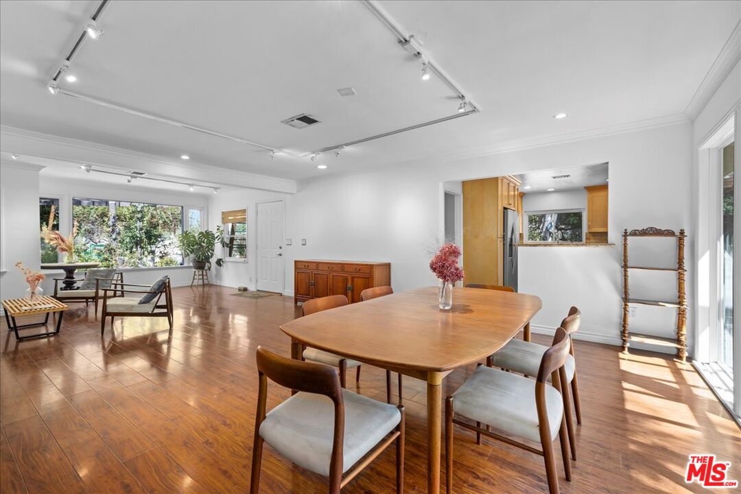 6867 Apperson Street Tujunga, CA 91042 - Photo 17 of 54 a view of a dining room with furniture window and wooden floor