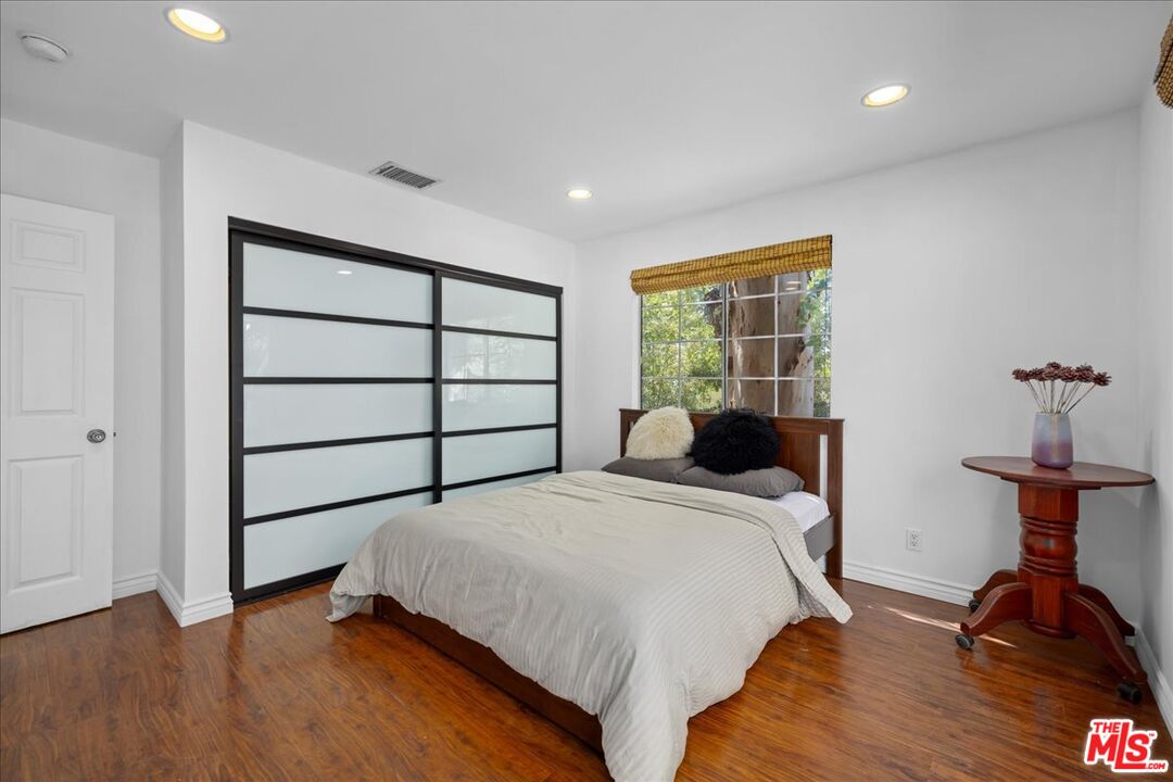6867 Apperson Street Tujunga, CA 91042 - Photo 20 of 54 a bedroom with a bed and a dresser