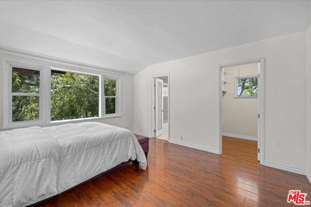 6867 Apperson Street Tujunga, CA 91042 - Photo 23 of 54 a bedroom with a bed and a window