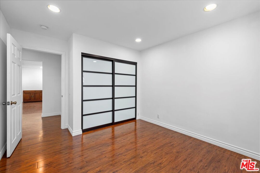 6867 Apperson Street Tujunga, CA 91042 - Photo 30 of 54 wooden floor in an empty room with a window