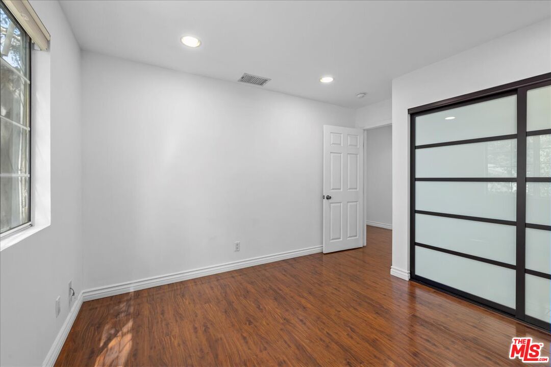6867 Apperson Street Tujunga, CA 91042 - Photo 31 of 54 a view of empty room with wooden floor and fan