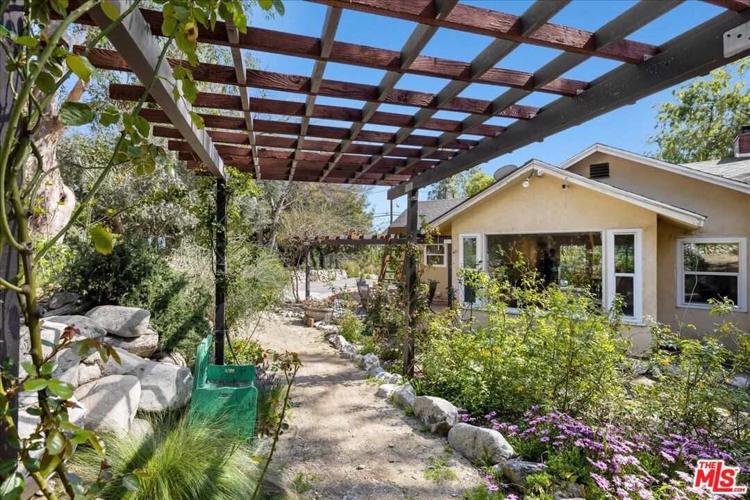 6867 Apperson Street Tujunga, CA 91042 - Photo 37 of 54 a front view of a house with a yard