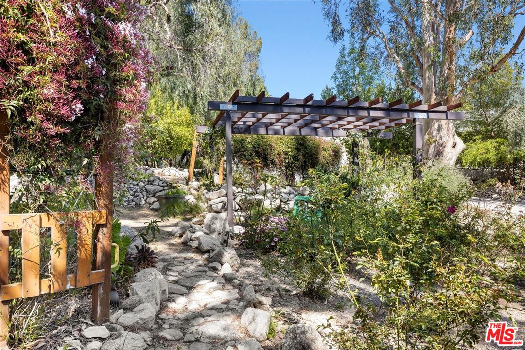 6867 Apperson Street Tujunga, CA 91042 - Photo 38 of 54 a view of a yard with large trees