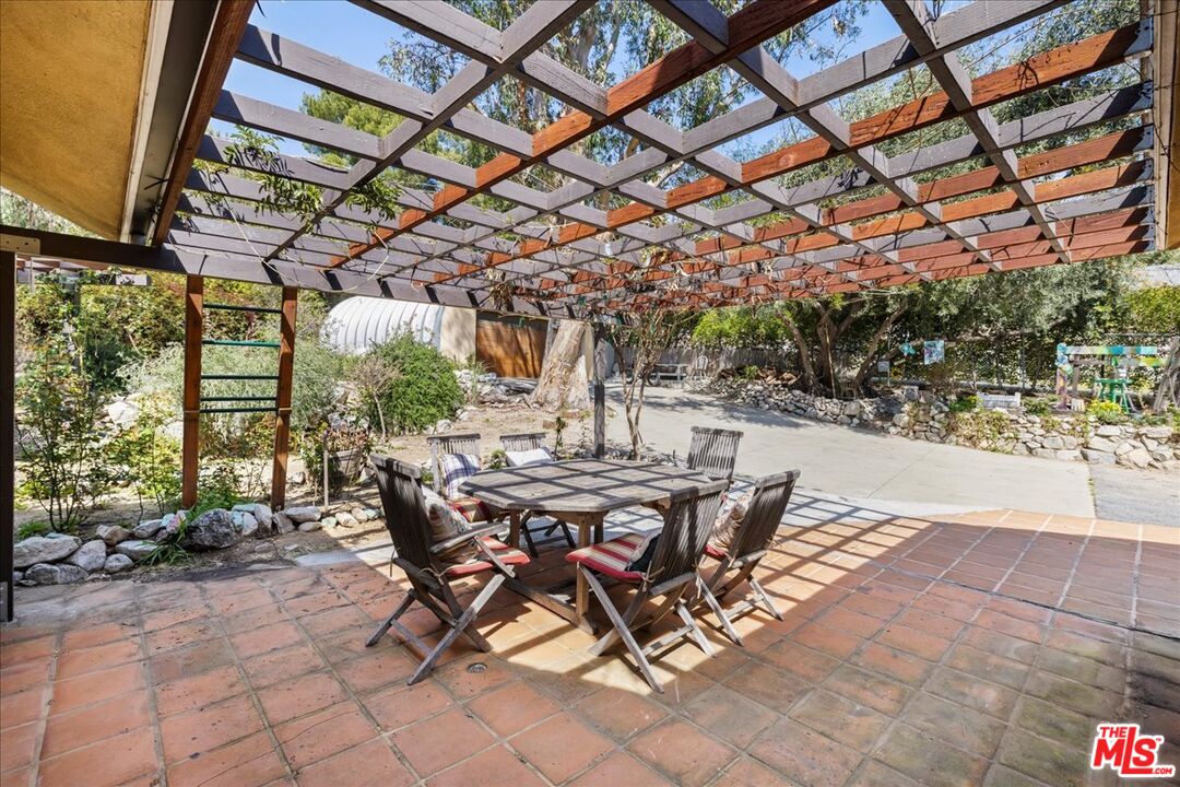 6867 Apperson Street Tujunga, CA 91042 - Photo 43 of 54 a view of a patio with table and chairs and potted plants