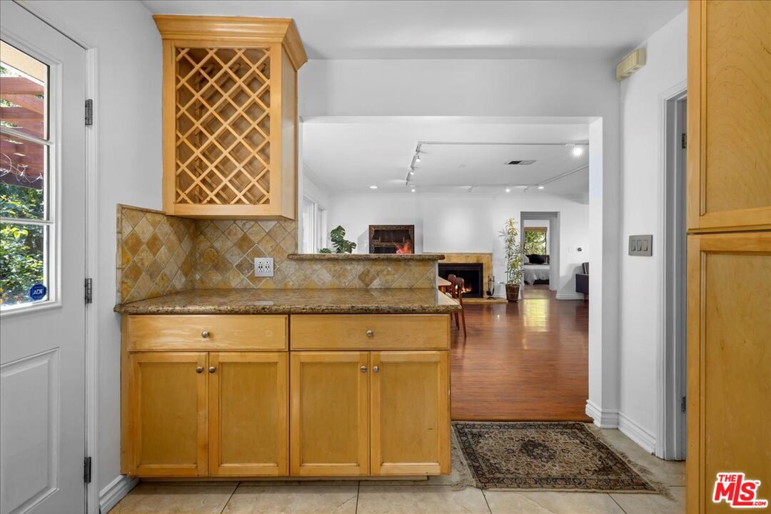 6867 Apperson Street Tujunga, CA 91042 - Photo 8 of 54 a kitchen with stainless steel appliances granite countertop a refrigerator and a stove