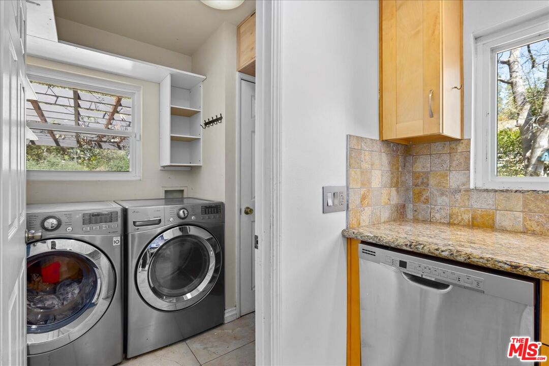 6867 Apperson Street Tujunga, CA 91042 - Photo 9 of 54 a utility room with sink dryer and washer