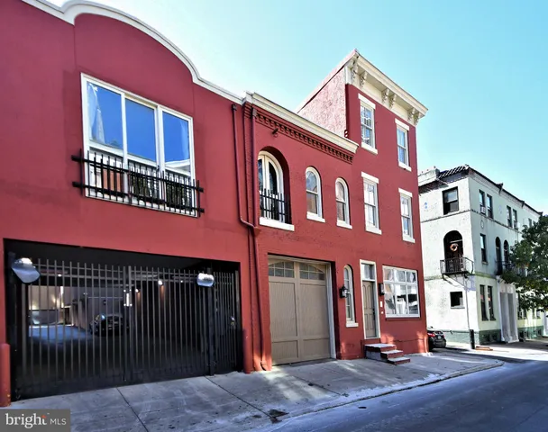 a front view of a building with lot of windows
