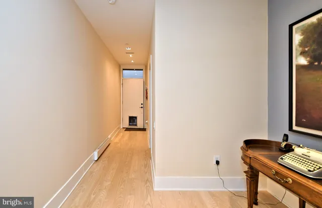 a view of room with wooden floor