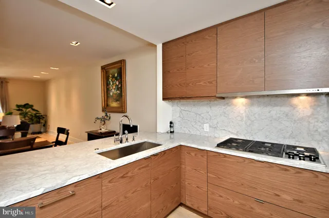a kitchen with granite countertop cabinets and stove