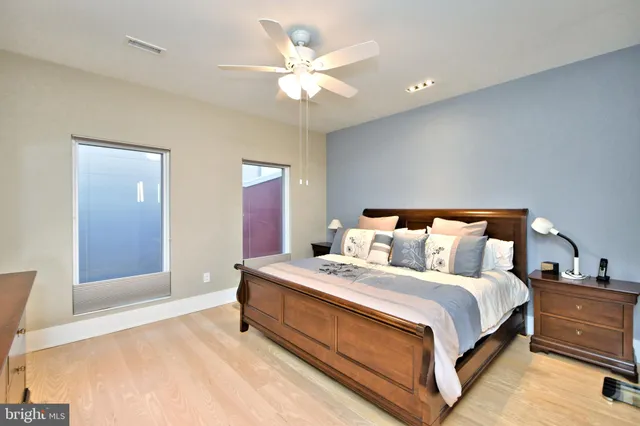 a bedroom with a bed and a dresser