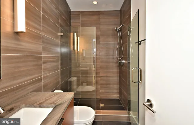 a bathroom with a shower and toilet
