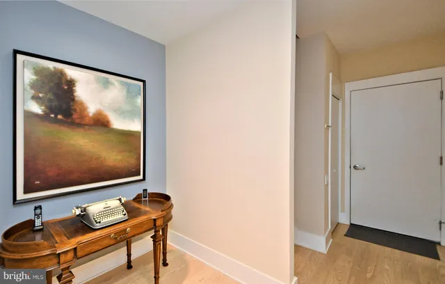 a room with furniture and painting on the wall