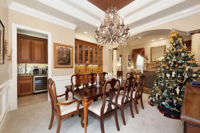 a kitchen with granite countertop a sink and white cabinets