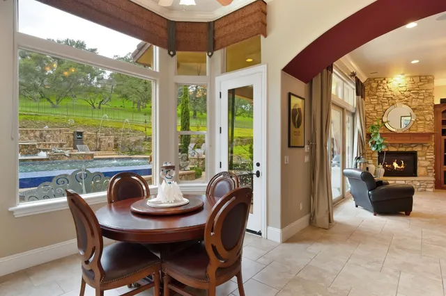 a kitchen with stainless steel appliances kitchen island granite countertop a refrigerator and a sink