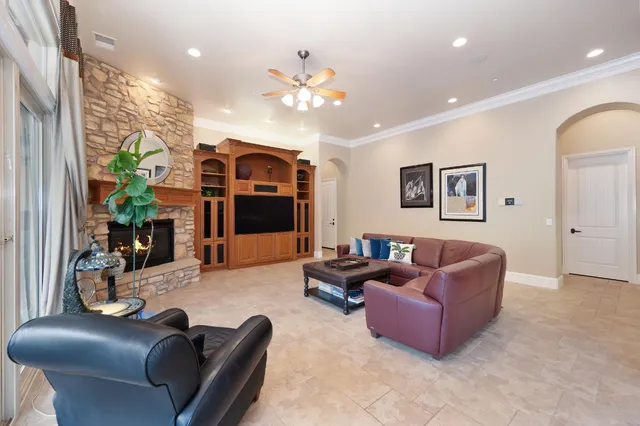 a kitchen with granite countertop stainless steel appliances a stove sink and cabinets