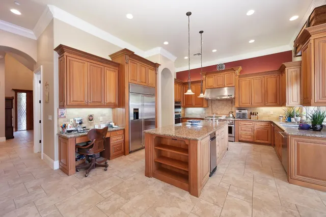 a large bathroom with a tub sink and mirror
