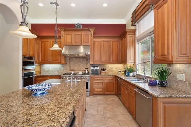 a bathroom with a sink double vanity and a tub