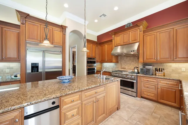 a living room with furniture gym equipment and a fireplace