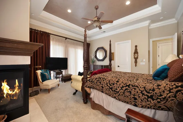 a bathroom with a tub a sink and mirror