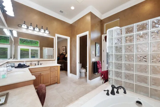 a bedroom with bed and window