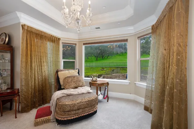 a view of a patio with table and chairs and potted plants