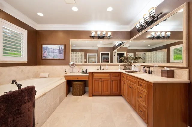 a view of a house with swimming pool and sitting area
