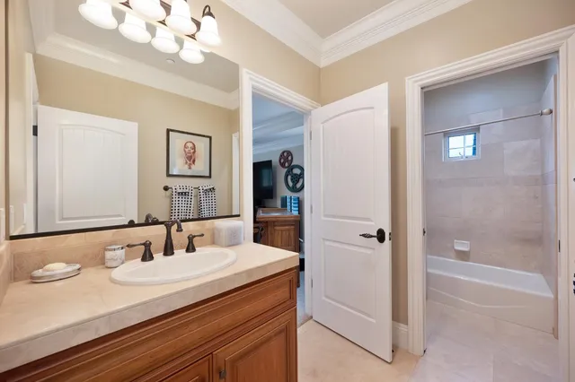 an aerial view of residential houses with outdoor space and parking