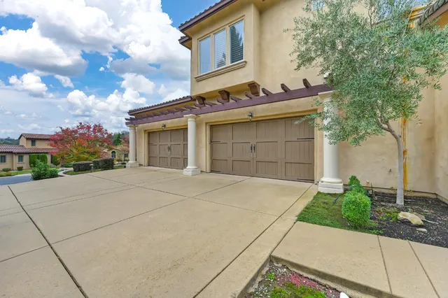 a view of a kitchen with stainless steel appliances granite countertop a stove and a wooden floors