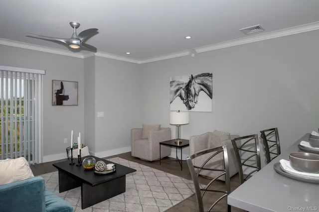 a living room with furniture and a table