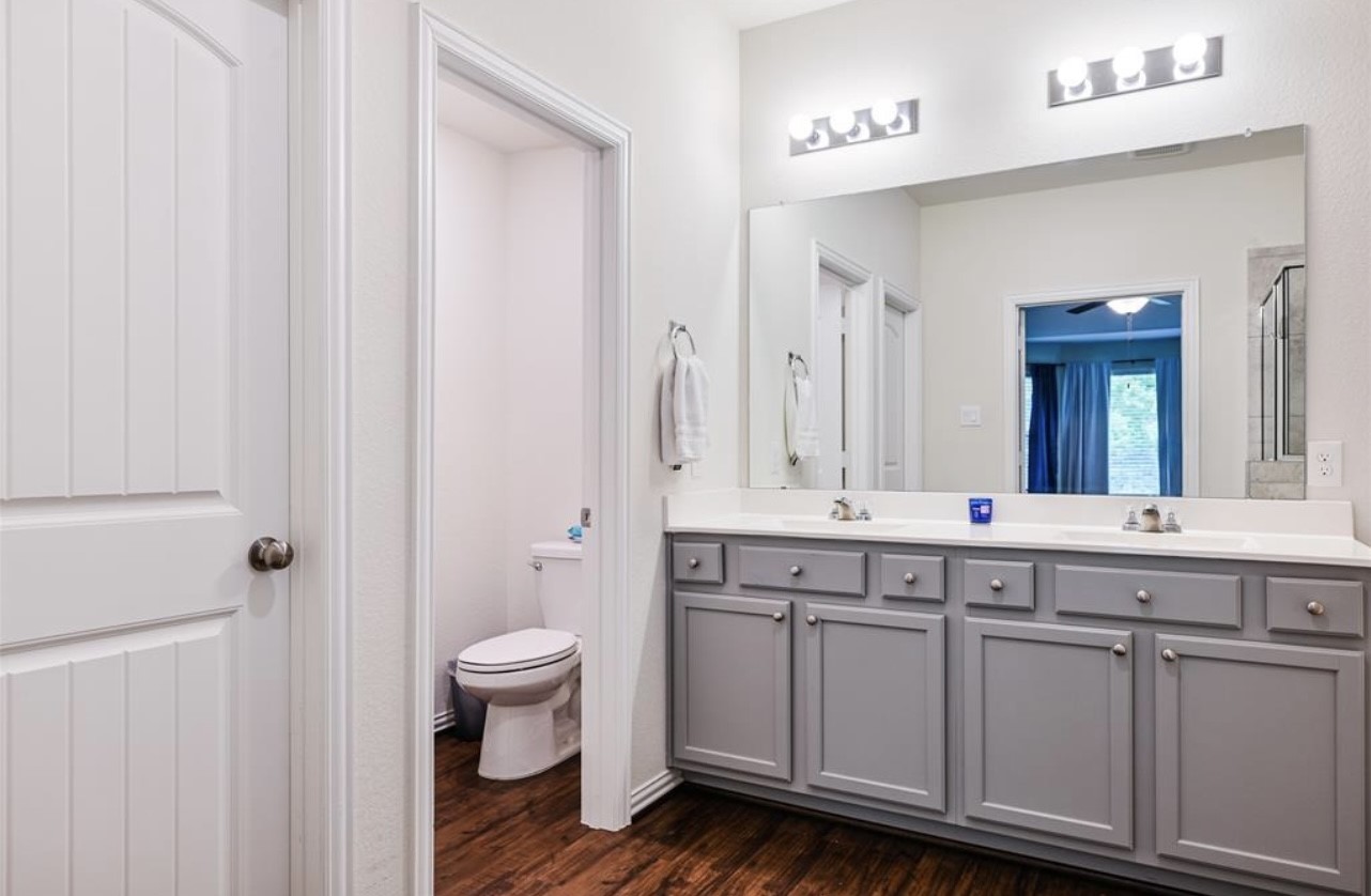 4639 Sequoia Echo Drive Spring, TX 77386 - Photo 15 of 26 a spacious bathroom with a double vanity sink a mirror and a toilet