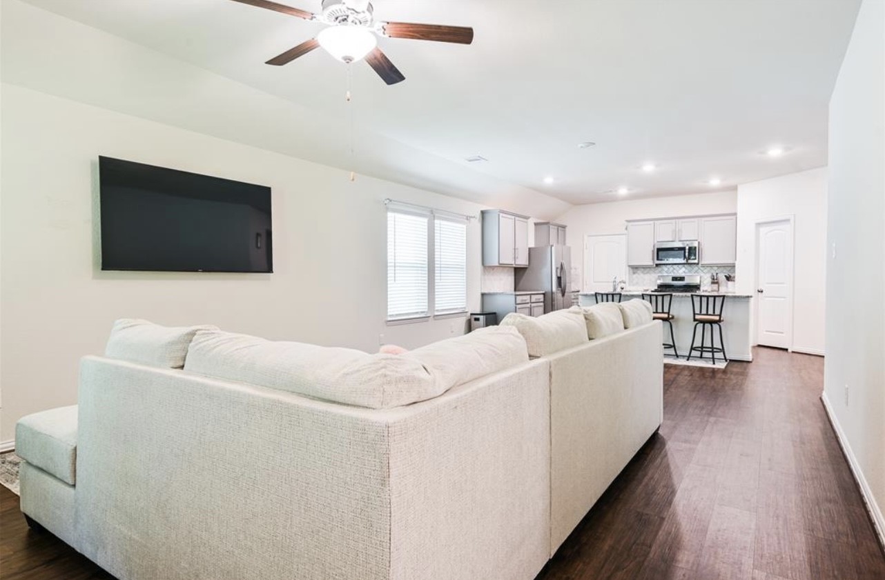 4639 Sequoia Echo Drive Spring, TX 77386 - Photo 4 of 26 a living room with furniture and a flat screen tv