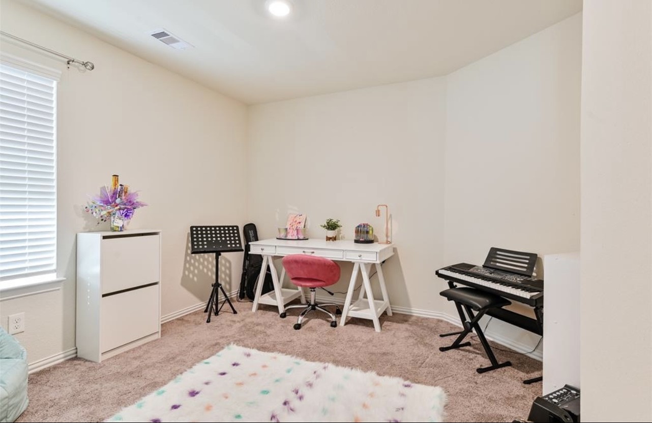 4639 Sequoia Echo Drive Spring, TX 77386 - Photo 9 of 26 a view of a workspace with furniture and a window