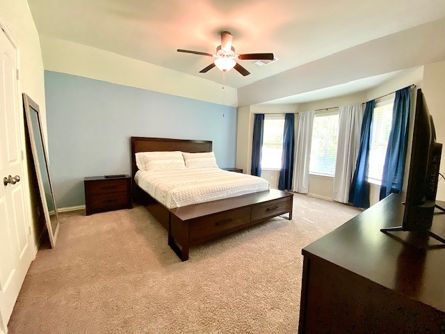 4639 Sequoia Echo Drive Spring, TX 77386 - Photo 10 of 26 a bedroom with a bed and a flat tv screen on dresser