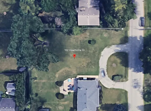 an aerial view of a house with swimming pool
