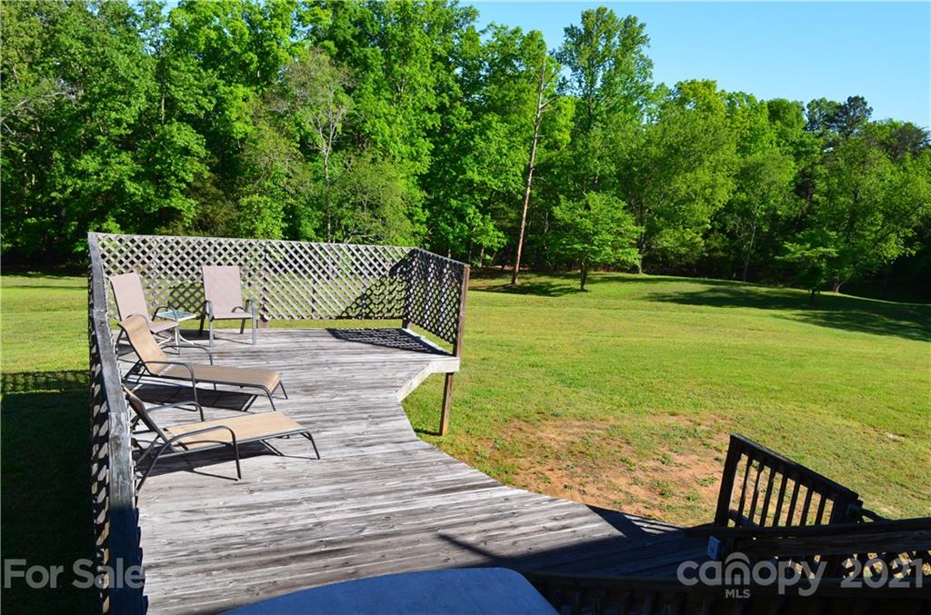625 McEntire Road Tryon, NC 28782 - Photo 8 of 26 a view of a roof deck with chair and wooden floor
