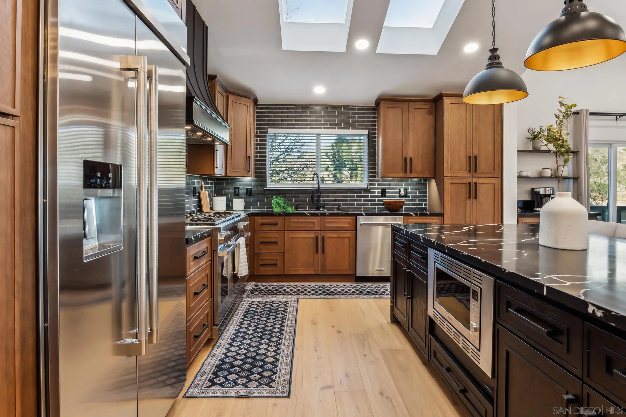 1326 Farmer Road Julian, CA 92036 - Photo 11 of 65 a kitchen with stainless steel appliances granite countertop a sink a stove and a refrigerator