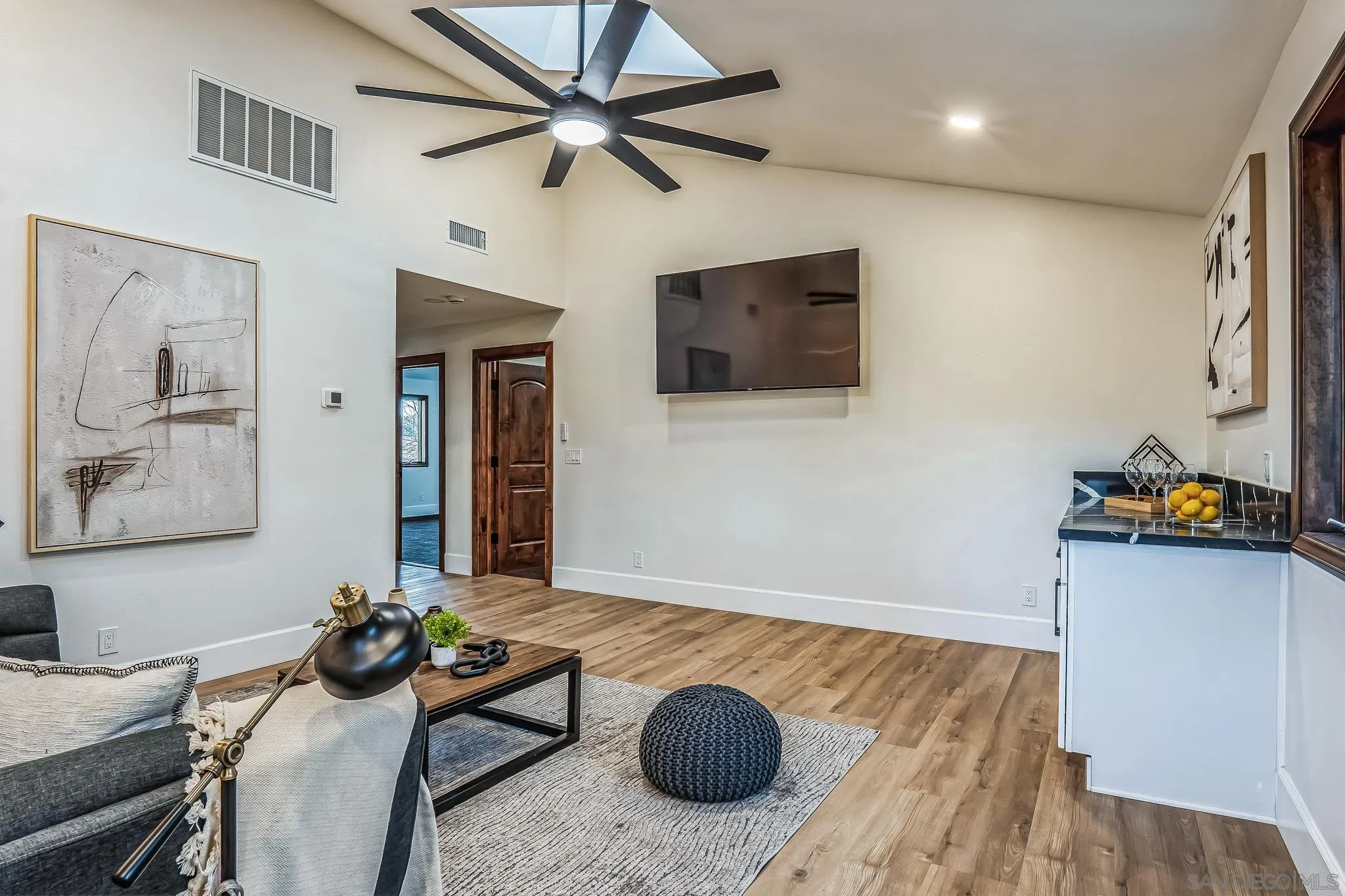 1326 Farmer Road Julian, CA 92036 - Photo 19 of 65 a living room with furniture and a flat screen tv