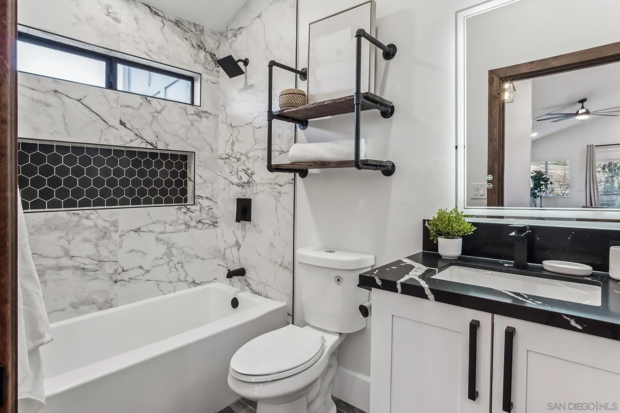 1326 Farmer Road Julian, CA 92036 - Photo 29 of 65 a bathroom with a sink a toilet and bathtub