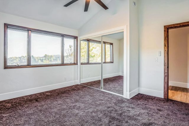 an aerial view of a house with a yard basket ball court and outdoor seating