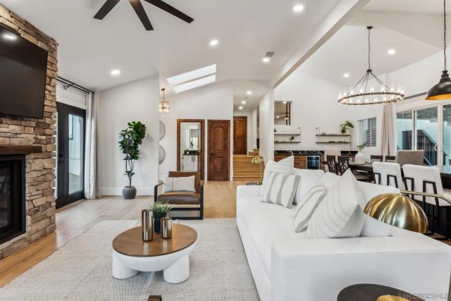 a kitchen with stainless steel appliances granite countertop a stove and a refrigerator