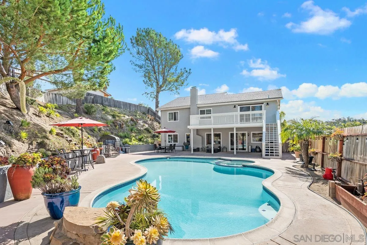3573 Ridge Road Oceanside, CA 92056 - Photo 1 of 40 a view of a house with swimming pool and sitting area