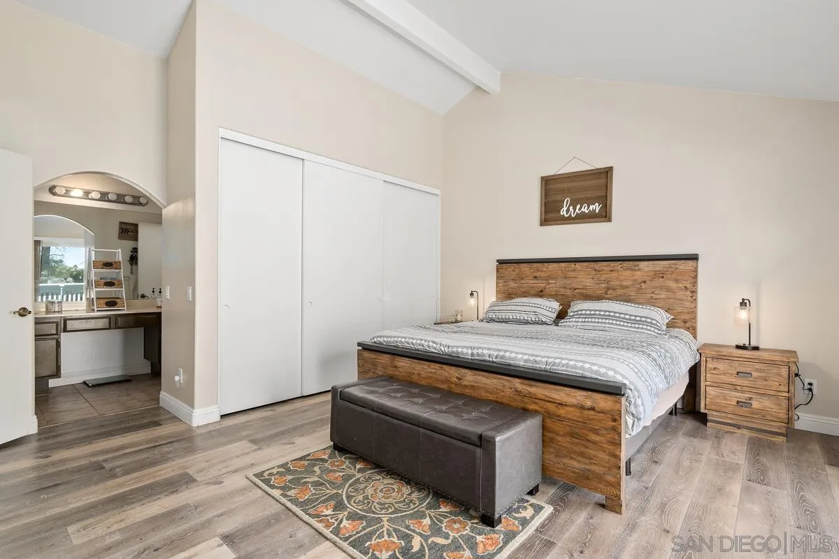 3573 Ridge Road Oceanside, CA 92056 - Photo 23 of 40 a bedroom with a bed and a view of kitchen