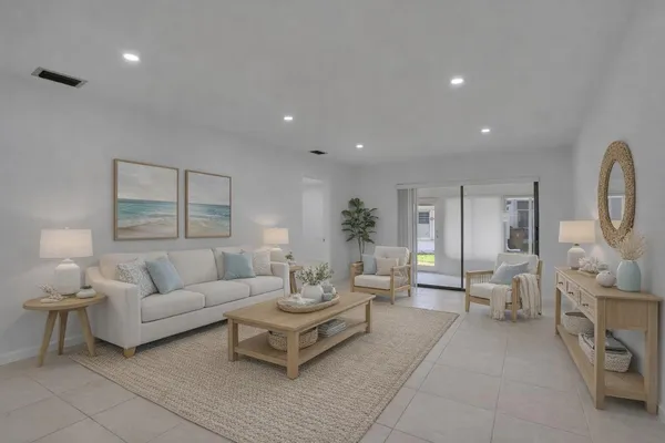 a living room with furniture and a large window