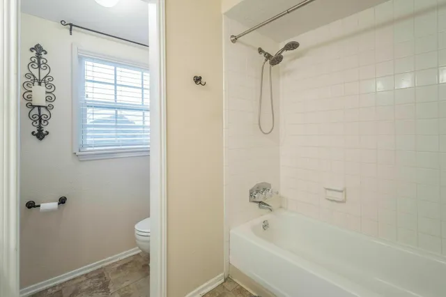 a view of a porch with furniture and a yard