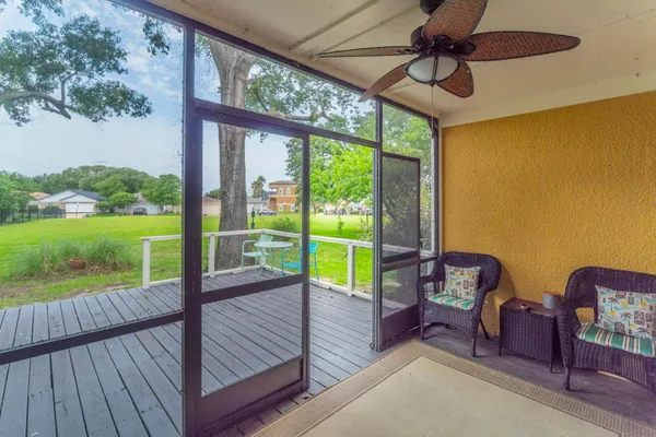 a view of a balcony with wooden floor and outdoor space