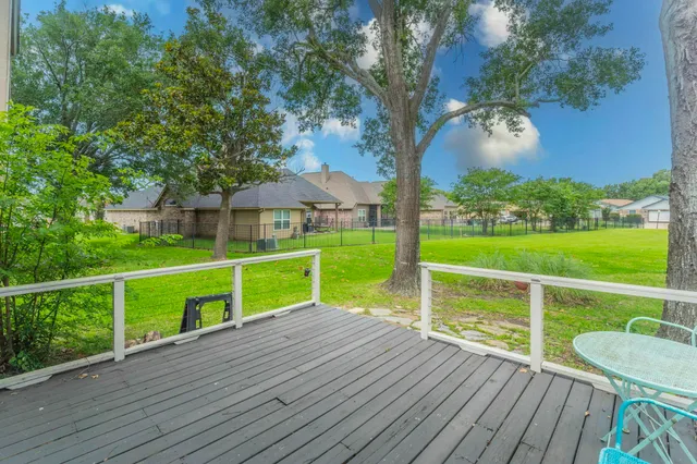 a front view of a building with a garden