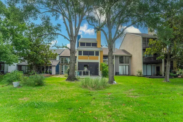 a view of yard with grass & street