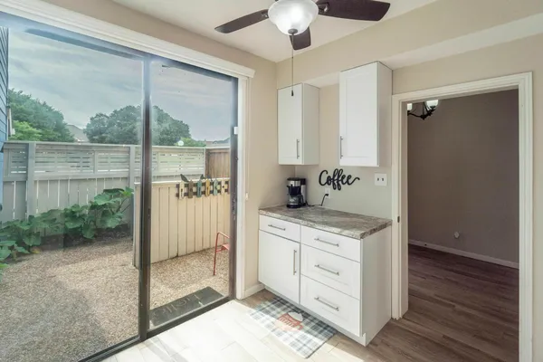 a kitchen with a sink and a mirror