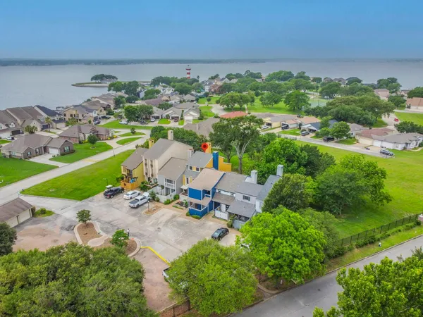 an aerial view of a houses with outdoor space and street view