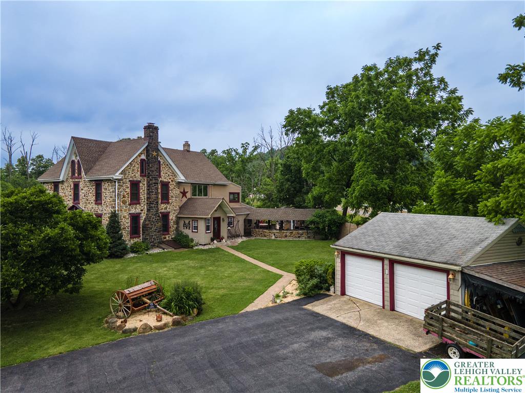 2485 Hieter Road Quakertown, PA 18951 - Photo 70 of 97 A sprawling estate with stone construction, a generous yard, and a detached garage.